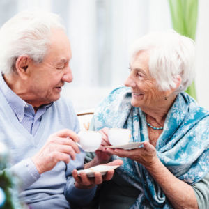 Senior man and woman drinking tea