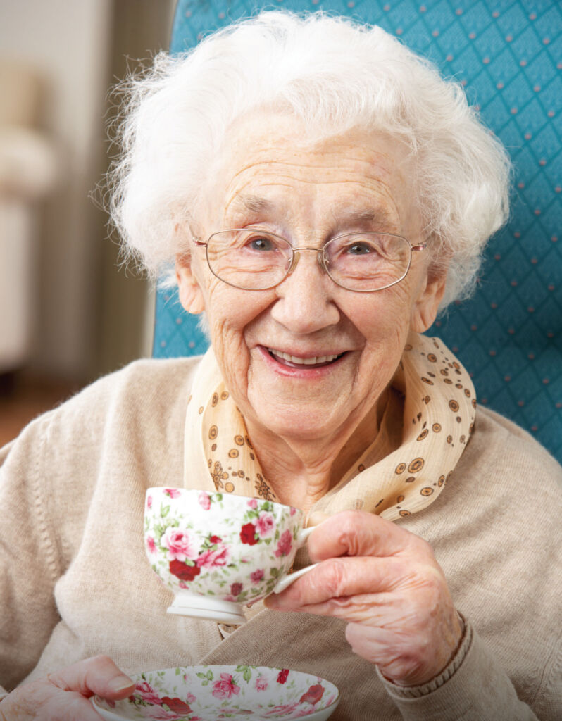 senior woman enjoying a warm cup of tea