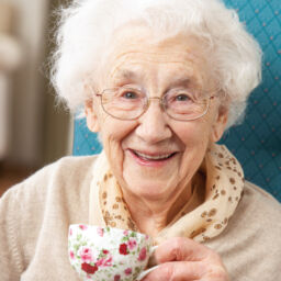 senior woman enjoying a warm cup of tea