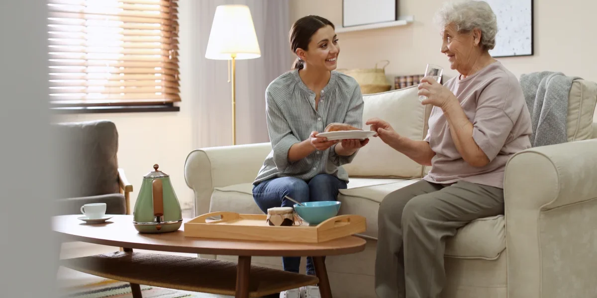 Caregiver helping senior with Activities