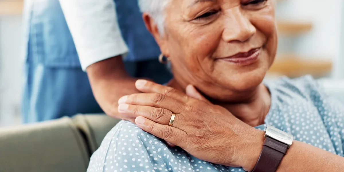 Senior woman being comforted in apartment
